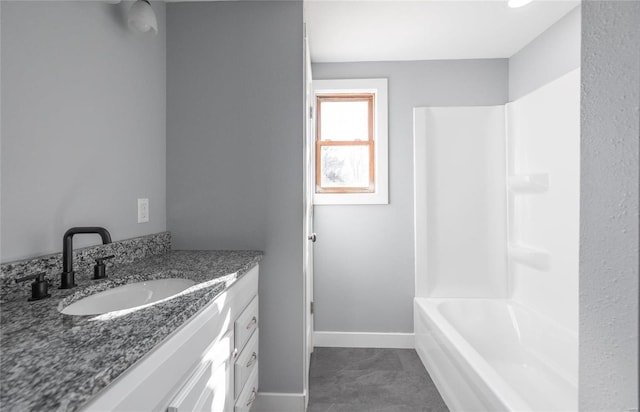 bathroom featuring vanity and bathing tub / shower combination