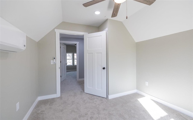 bonus room with ceiling fan, lofted ceiling, light carpet, and a wall unit AC