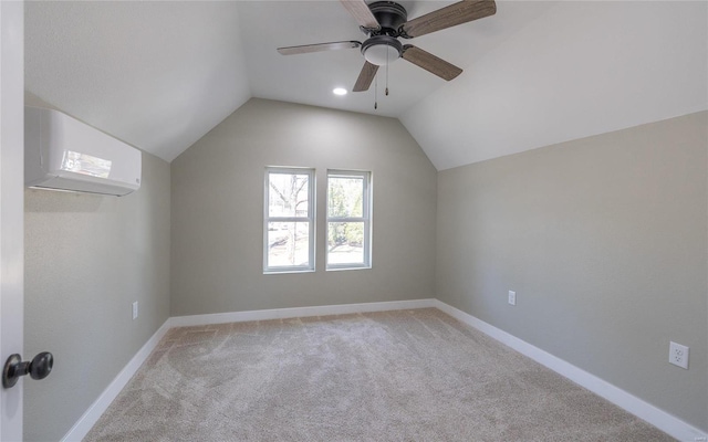 additional living space featuring light carpet, vaulted ceiling, a wall unit AC, and ceiling fan