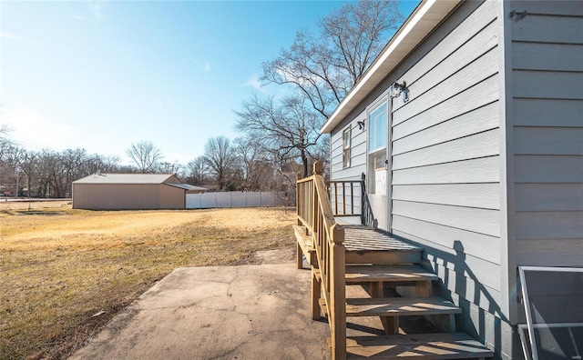 view of yard with a patio and a storage shed