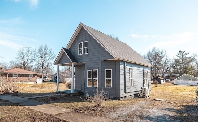 view of home's exterior with roof with shingles