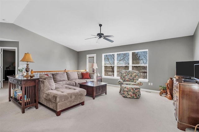 carpeted living room featuring ceiling fan and vaulted ceiling