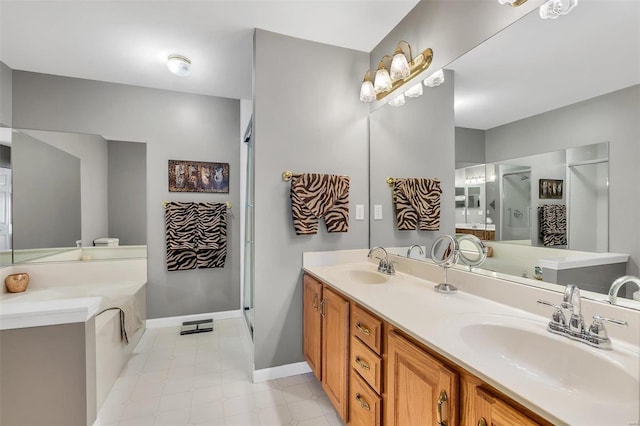 bathroom with vanity and independent shower and bath