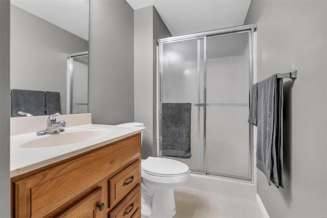 bathroom with toilet, walk in shower, and vanity