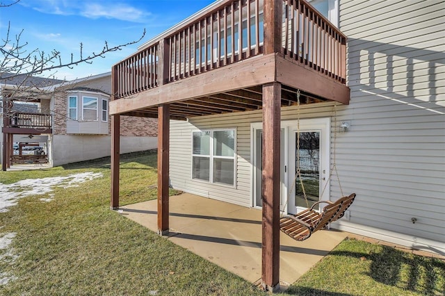 exterior space with a patio area, a yard, and a wooden deck