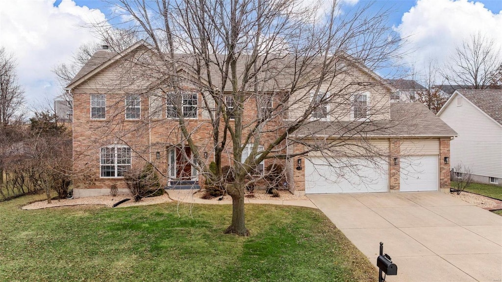 view of front of home with a garage and a front yard