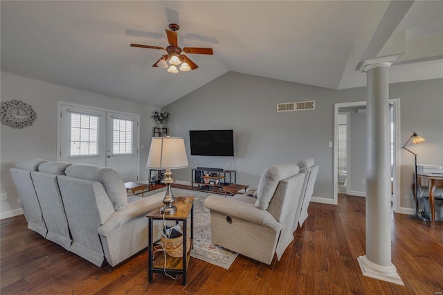 living room featuring ceiling fan, decorative columns, lofted ceiling, and dark hardwood / wood-style flooring