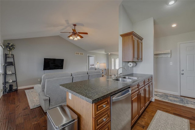 kitchen featuring sink, stainless steel dishwasher, dark wood-type flooring, and vaulted ceiling