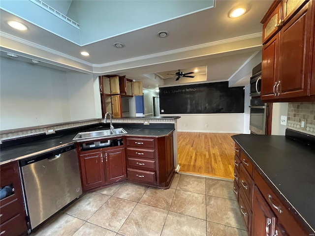 kitchen featuring appliances with stainless steel finishes, sink, ornamental molding, ceiling fan, and light tile patterned floors