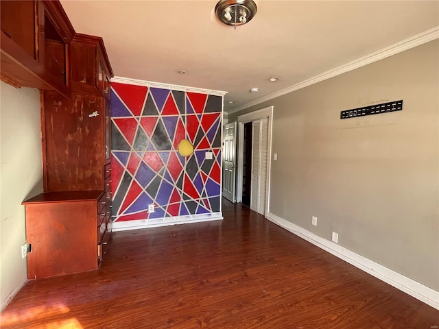 unfurnished room with ornamental molding and dark wood-type flooring