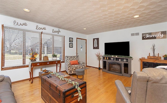 living room with light hardwood / wood-style floors