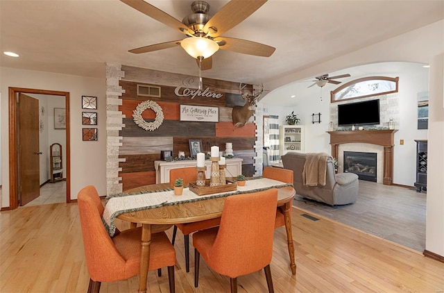 dining space featuring ceiling fan and light hardwood / wood-style floors