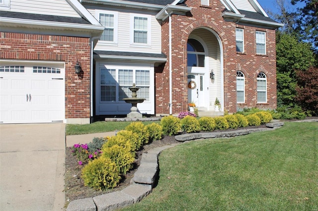 view of front of home featuring a garage and a front yard