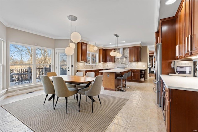 dining room featuring ornamental molding