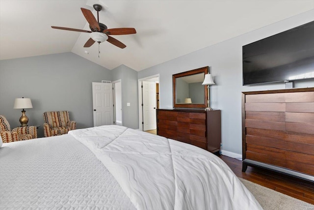 bedroom featuring ceiling fan, lofted ceiling, and dark hardwood / wood-style flooring