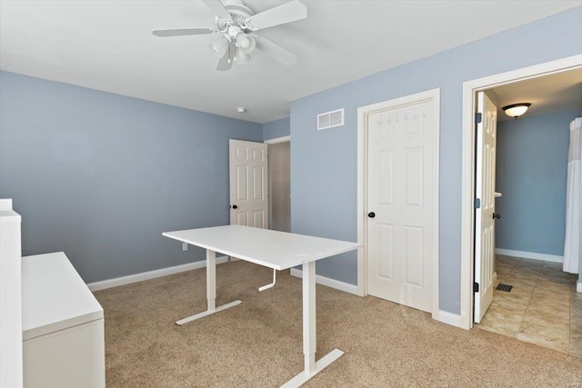 office area with light colored carpet and ceiling fan