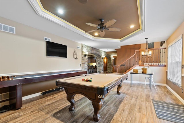 recreation room featuring crown molding, ceiling fan, wood-type flooring, pool table, and a raised ceiling