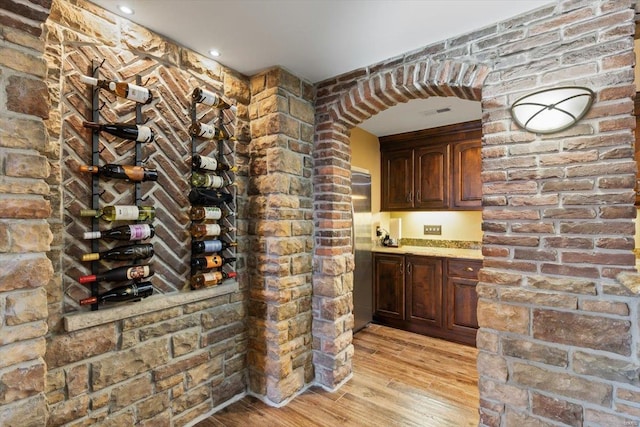 wine cellar with light wood-type flooring