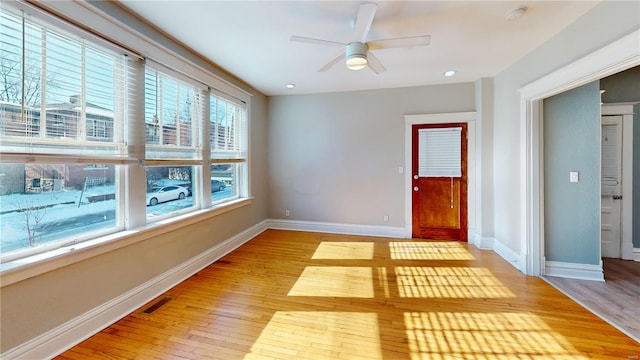 unfurnished room featuring ceiling fan and light hardwood / wood-style flooring