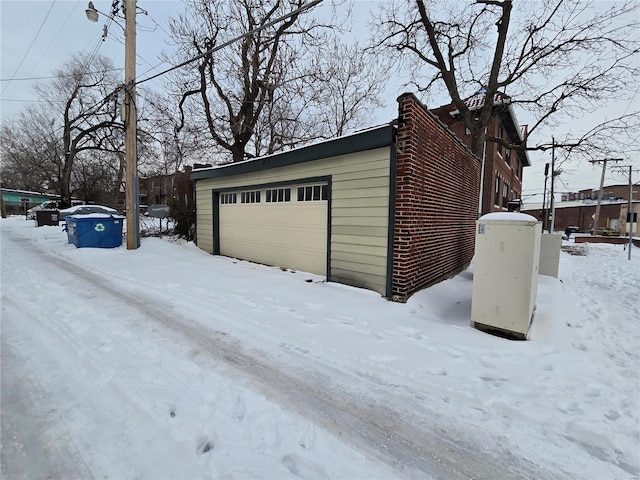 view of snow covered garage