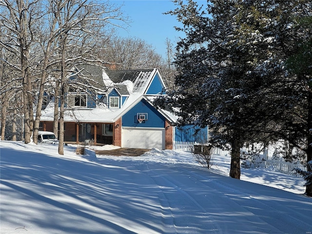 view of front facade featuring a porch and a garage