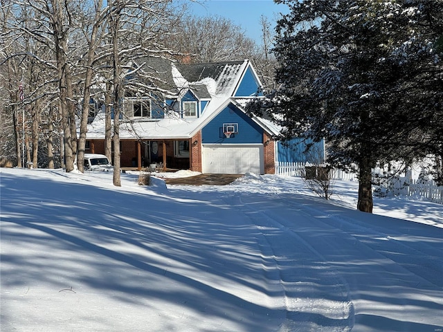 view of front of house with a porch and a garage