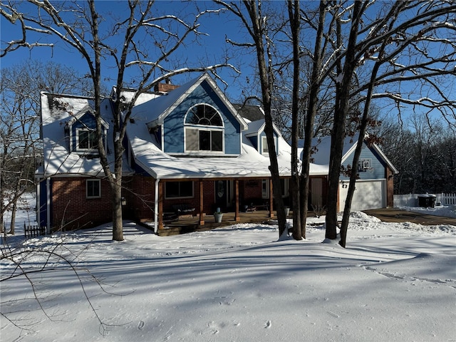 view of front facade with a garage and a porch