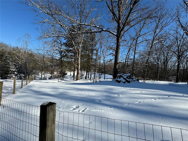 view of yard layered in snow