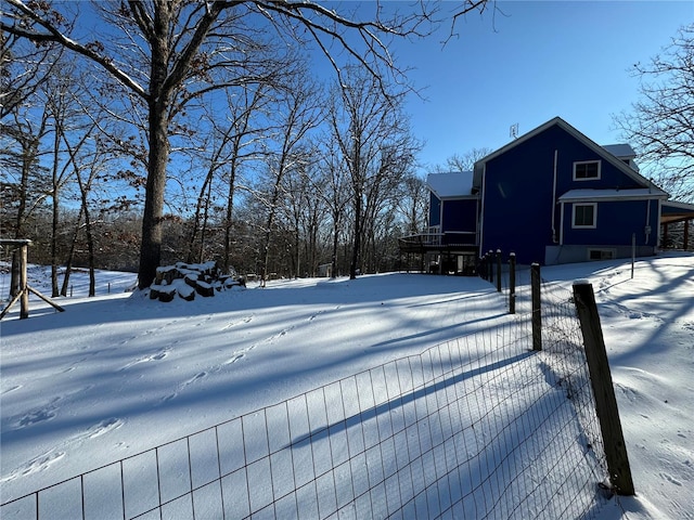 view of yard layered in snow