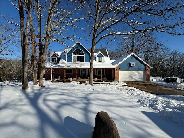 view of front of house featuring a garage and covered porch