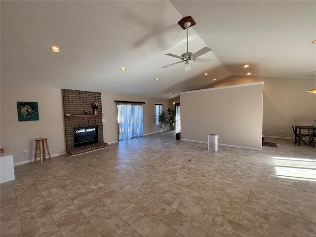 unfurnished living room featuring lofted ceiling, a fireplace, and ceiling fan