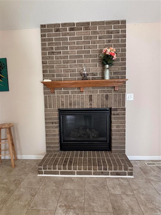 interior details with a brick fireplace