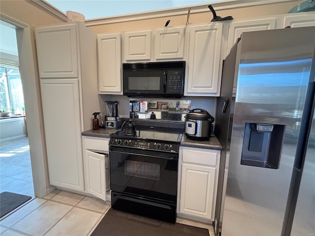 kitchen with white cabinetry, light tile patterned floors, and black appliances