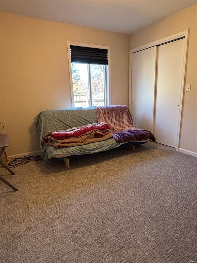 carpeted bedroom with a closet