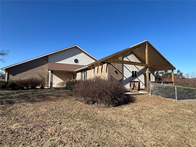 view of property exterior with a yard