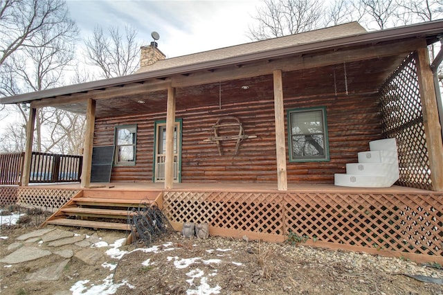 rear view of property with a porch