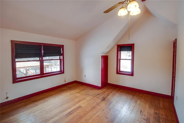 bonus room with ceiling fan, light hardwood / wood-style floors, and lofted ceiling