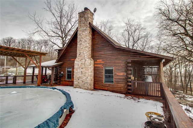 snow covered property featuring a trampoline