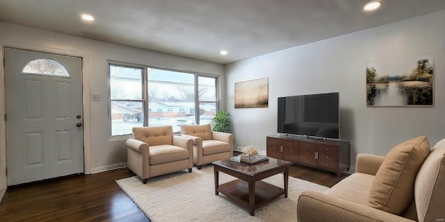 living area with recessed lighting, baseboards, and wood finished floors