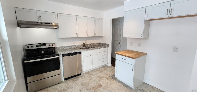 kitchen with sink, wooden counters, white cabinets, and appliances with stainless steel finishes