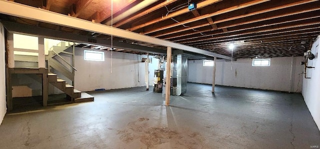 basement featuring heating unit and gas water heater