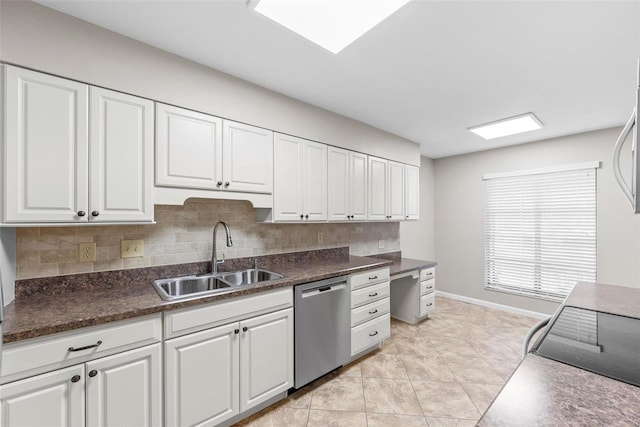 kitchen with dishwasher, sink, white cabinets, backsplash, and light tile patterned floors