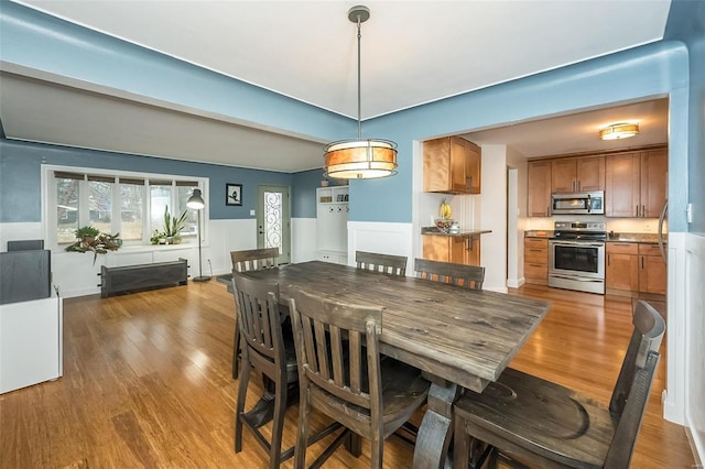 dining room with hardwood / wood-style flooring