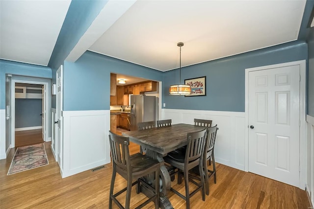 dining room featuring light hardwood / wood-style flooring