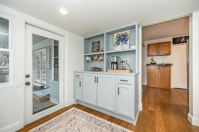 doorway with light hardwood / wood-style flooring