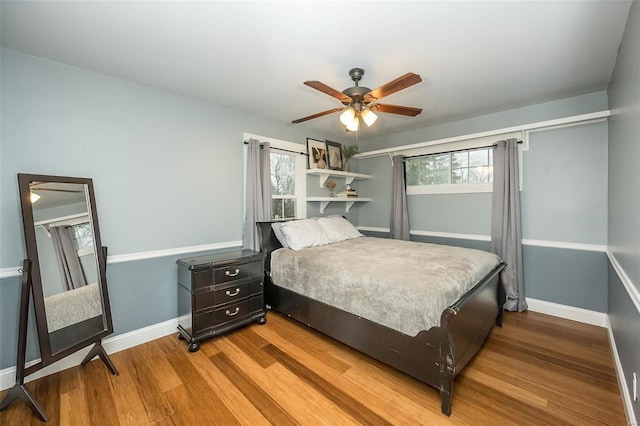 bedroom featuring ceiling fan and hardwood / wood-style floors