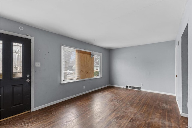 entryway with dark wood-type flooring