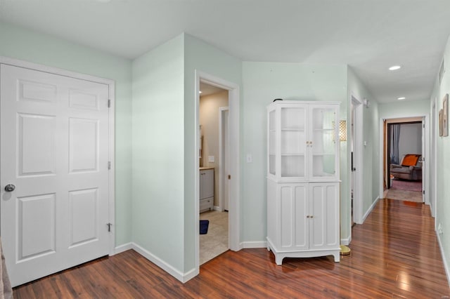 hallway featuring dark hardwood / wood-style floors