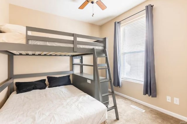 carpeted bedroom featuring ceiling fan