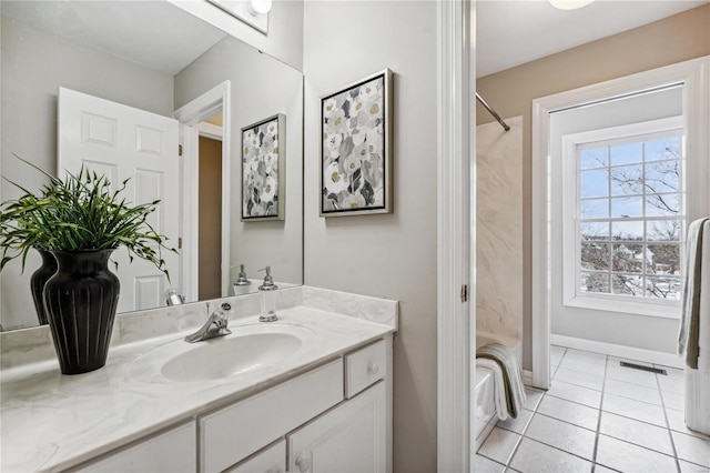 bathroom with tile patterned flooring, shower / bath combo, and vanity